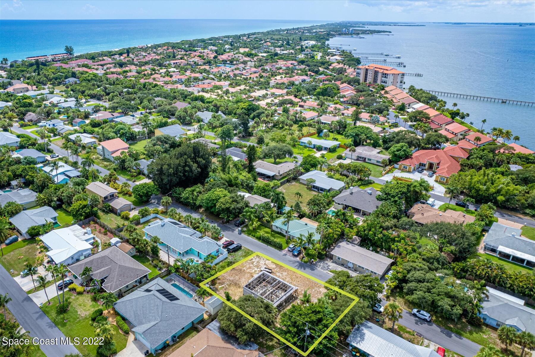 an aerial view of residential houses with outdoor space