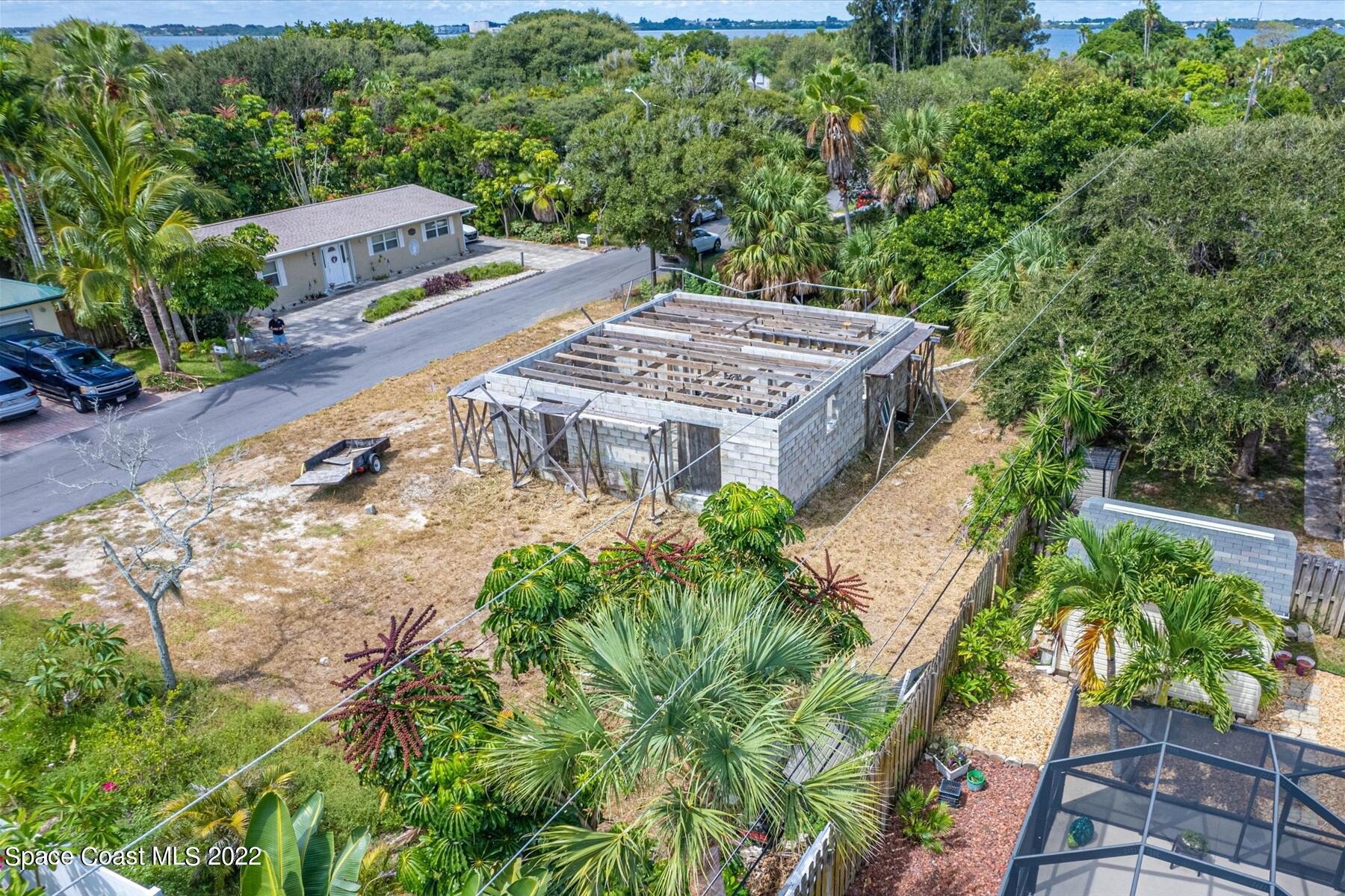 290 Rita Boulevard Melbourne Beach, FL 32951 - Photo 16 of 21 an aerial view of a house with yard and patio
