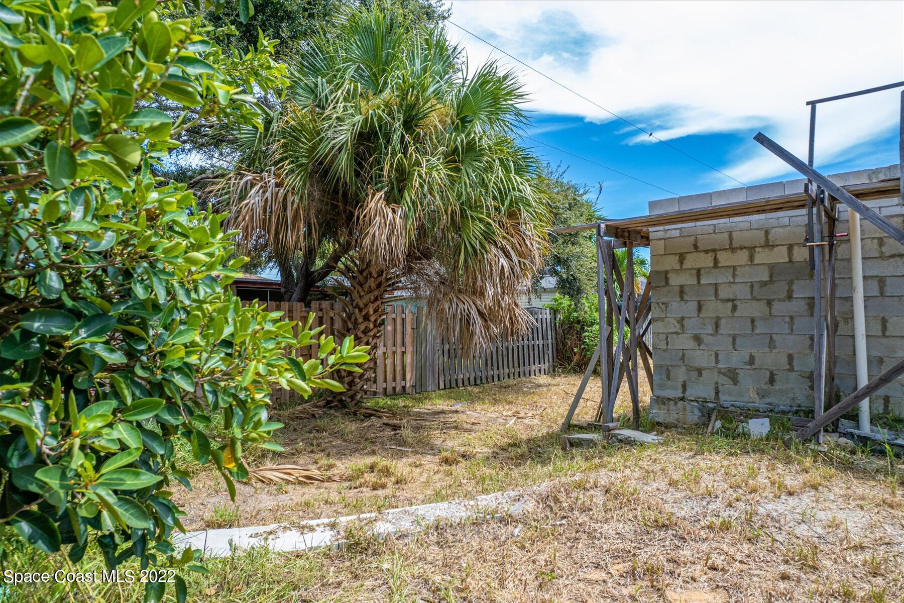 290 Rita Boulevard Melbourne Beach, FL 32951 - Photo 20 of 21 a view of a backyard with a tree