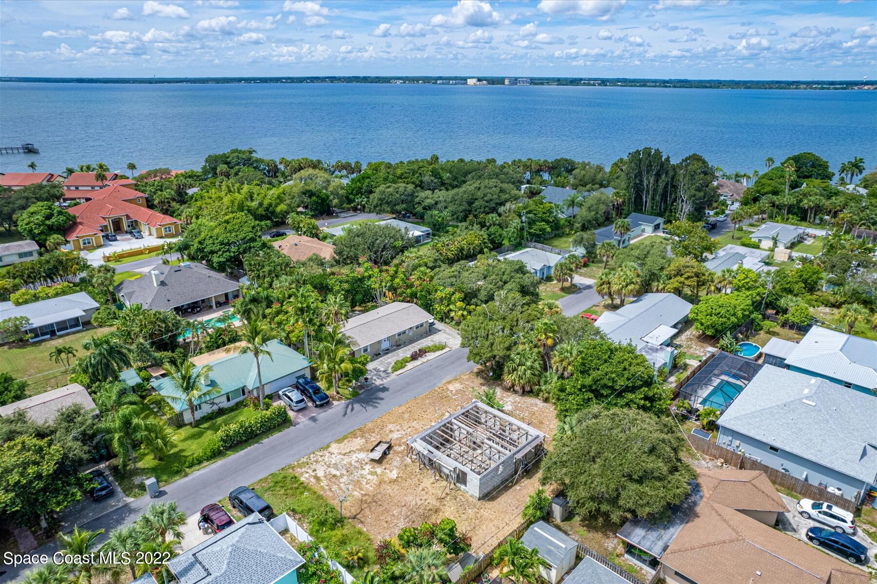 290 Rita Boulevard Melbourne Beach, FL 32951 - Photo 7 of 21 an aerial view of a house with a garden and lake view