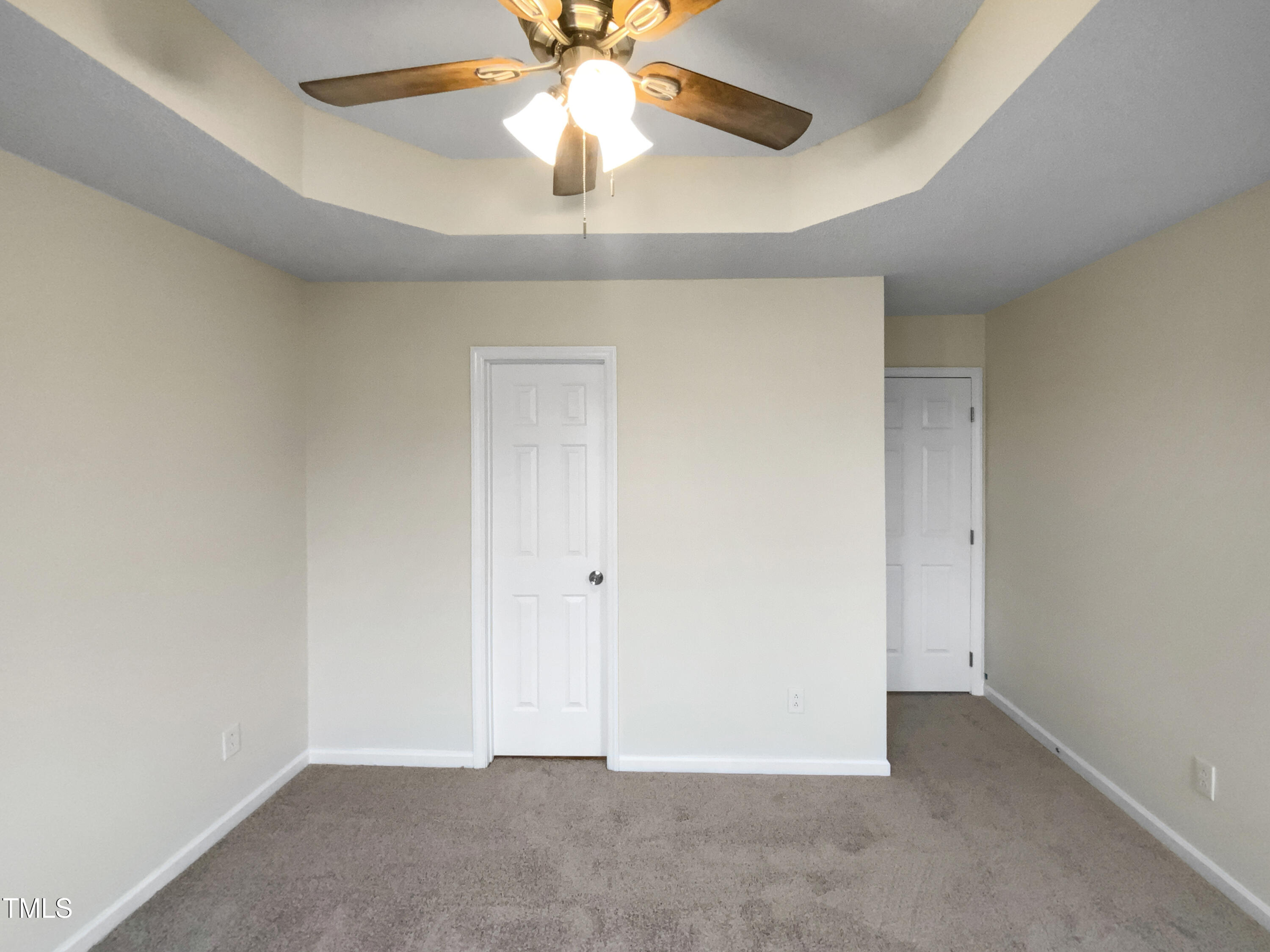 2013 Turtle Point Drive Raleigh, NC 27604 - Photo 13 of 20 an empty room with a chandelier fan and a ceiling fan