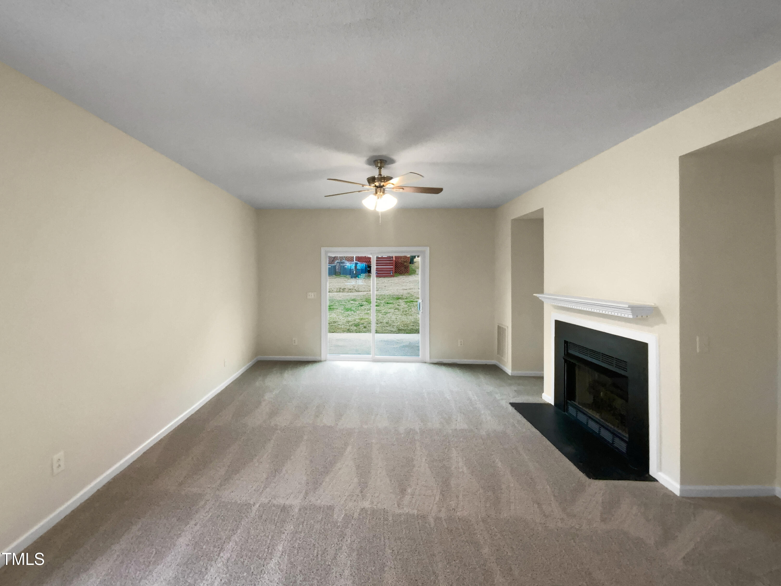 2013 Turtle Point Drive Raleigh, NC 27604 - Photo 3 of 20 an empty room with windows and fireplace