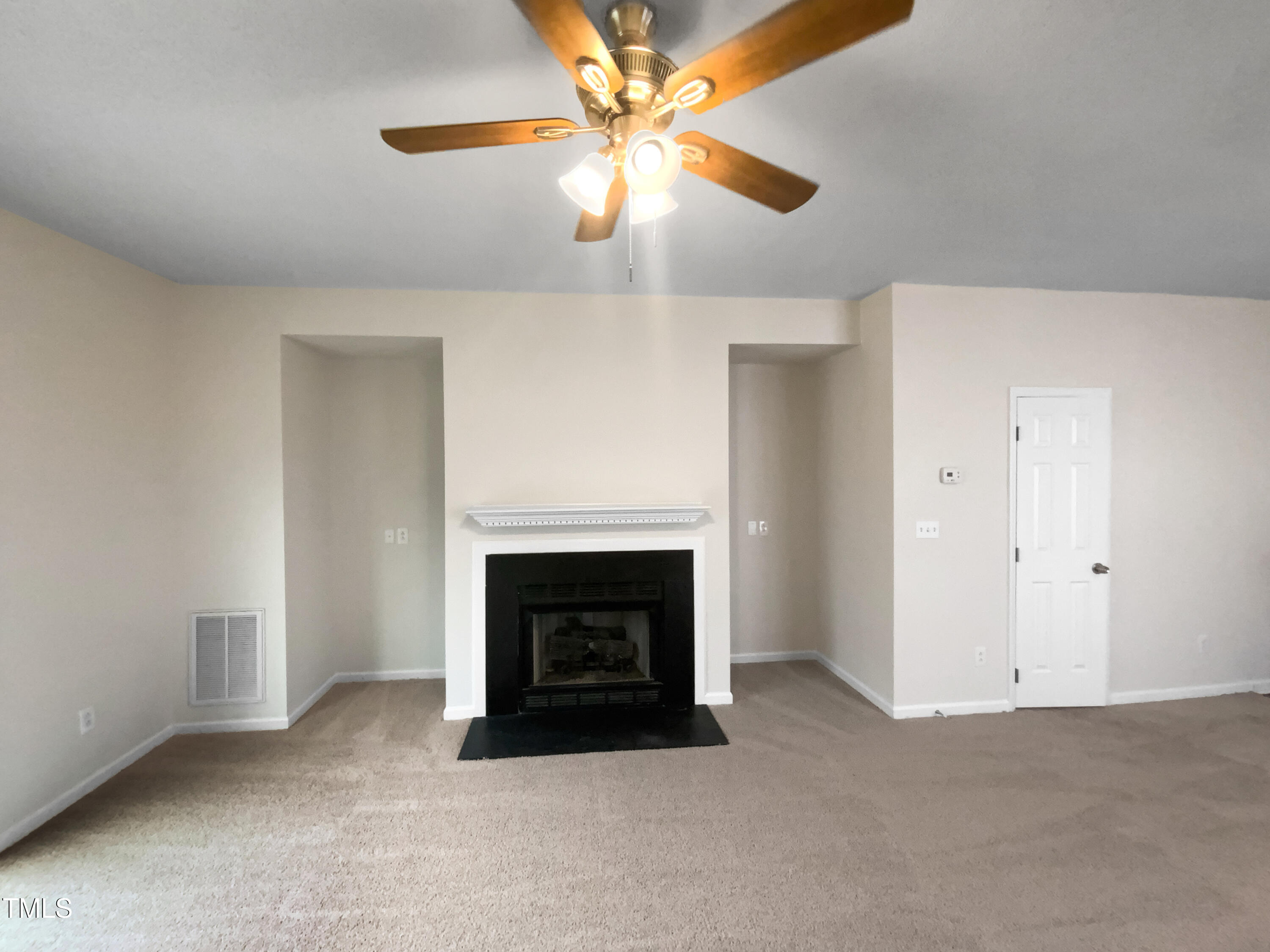 2013 Turtle Point Drive Raleigh, NC 27604 - Photo 4 of 20 an empty room with windows and fireplace