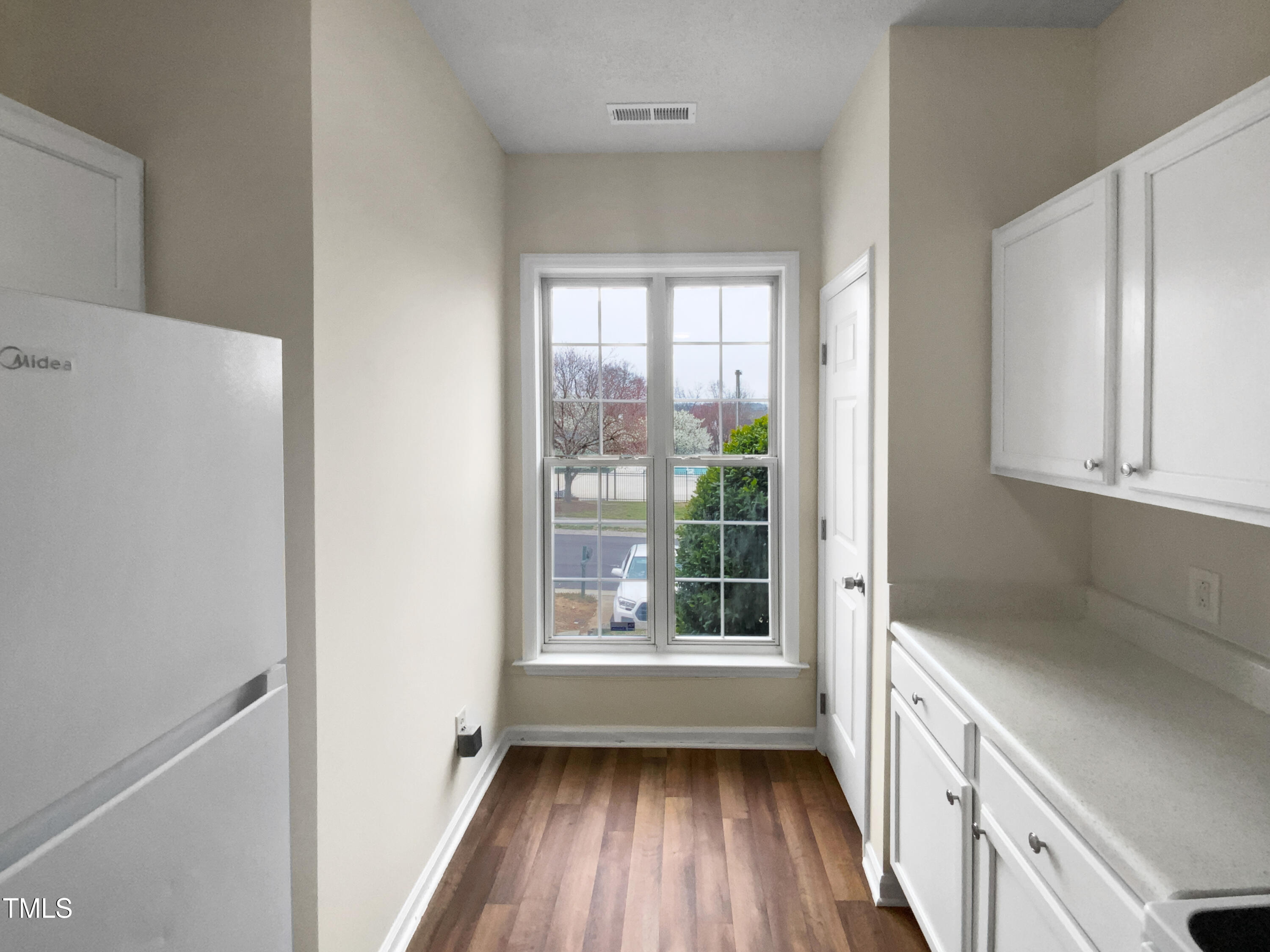 2013 Turtle Point Drive Raleigh, NC 27604 - Photo 8 of 20 a view of a kitchen with wooden floor and electronic appliances