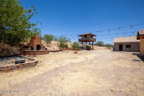480 Camino Ramanote Rio Rico, AZ 85648 - Photo 27 of 43 East view back yard, outdoor fireplace, playhouse and workshop.