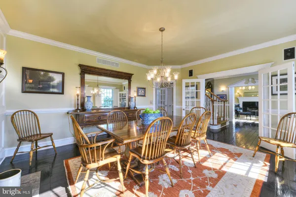 a large white kitchen with a large window