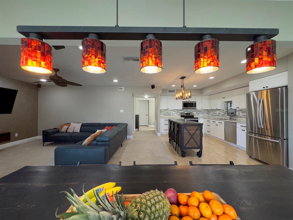 559 Fairways Circle Ocala, FL 34472 - Photo 2 of 29 a kitchen with stainless steel appliances kitchen island granite countertop a stove and a sink