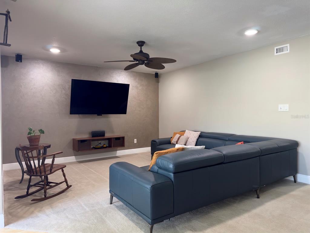 559 Fairways Circle Ocala, FL 34472 - Photo 3 of 29 a living room with furniture and a flat screen tv