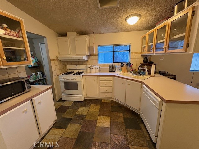 100 Ski Trails Road, Unit 42 Mammoth Lakes, CA 93546 - Photo 3 of 15 a kitchen with a sink a stove and cabinets