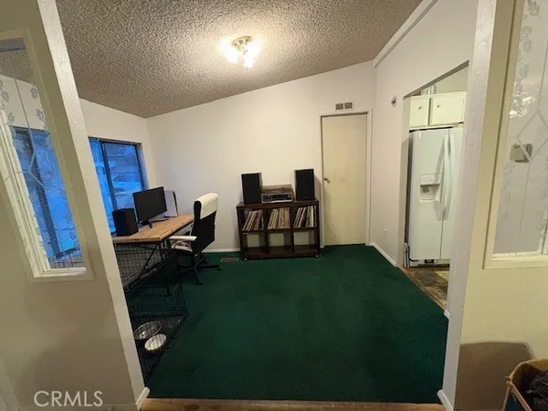 a workspace with furniture and a window