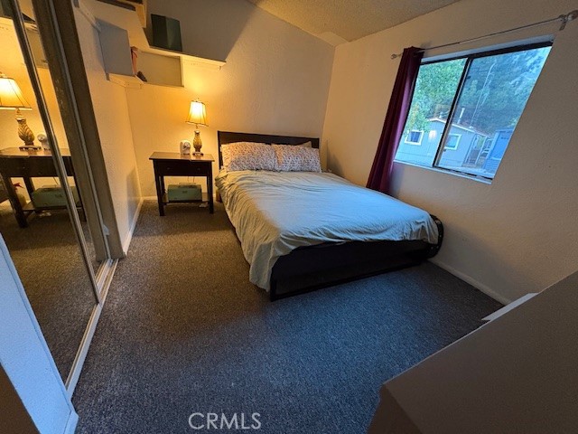 100 Ski Trails Road, Unit 42 Mammoth Lakes, CA 93546 - Photo 10 of 15 a bedroom with a bed and a mirror