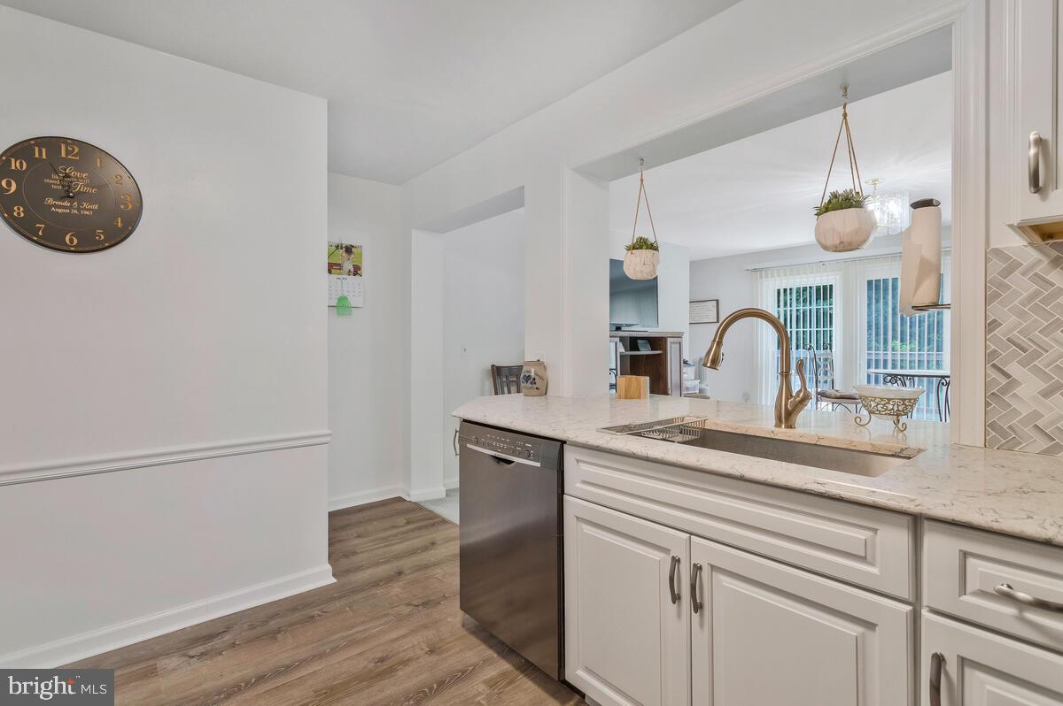 22 Robshire Manor Road Huntingtown, MD 20639 - Photo 11 of 44 a kitchen with a sink cabinets and wooden floor