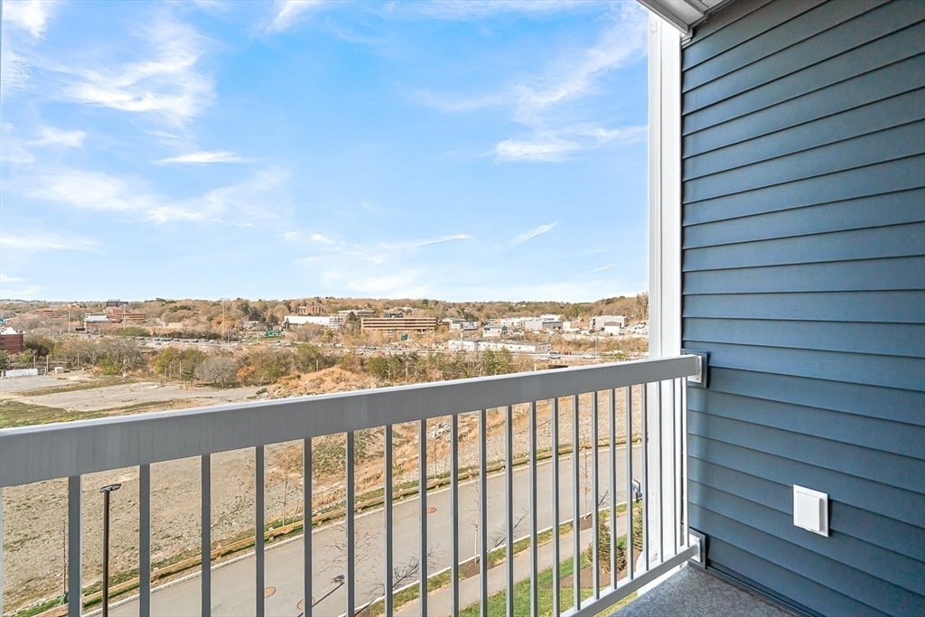 2 Stratton Drive, Unit 307 Woburn, MA 01801 - Photo 18 of 21 a view of city and mountain from a balcony