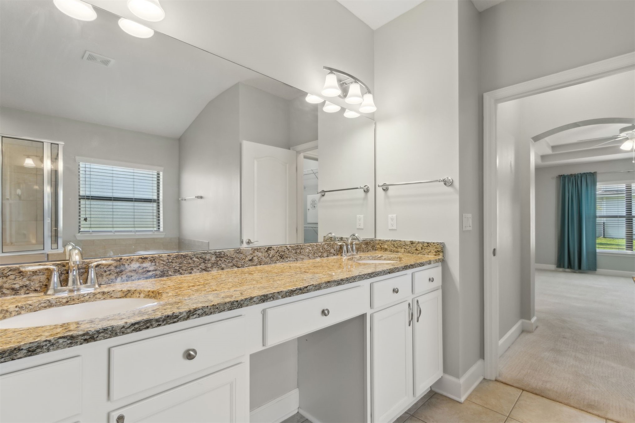 33146 Prairie Parke Place Fernandina Beach, FL 32034 - Photo 8 of 28 a bathroom with a granite countertop double vanity sink and mirror