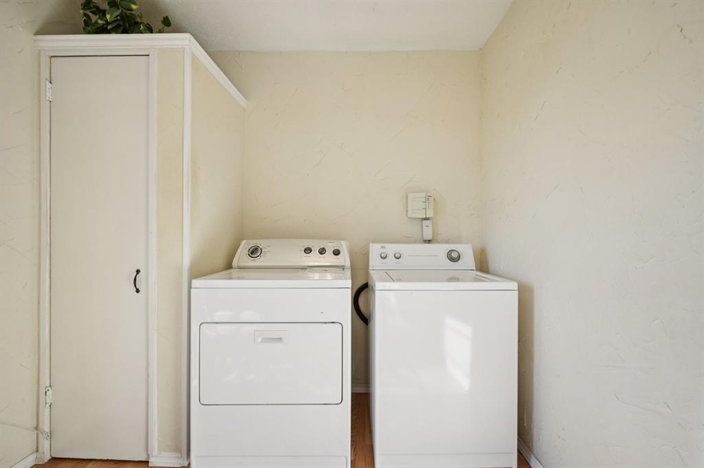 1021 Pleasant Valley Road Garland, TX 75040 - Photo 24 of 32 a utility room with dryer and washer