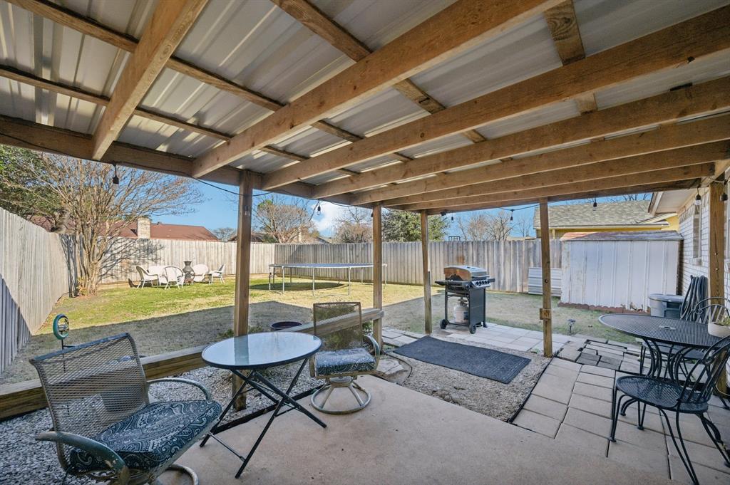 1021 Pleasant Valley Road Garland, TX 75040 - Photo 27 of 32 a view of a chairs and table in patio with a barbeque