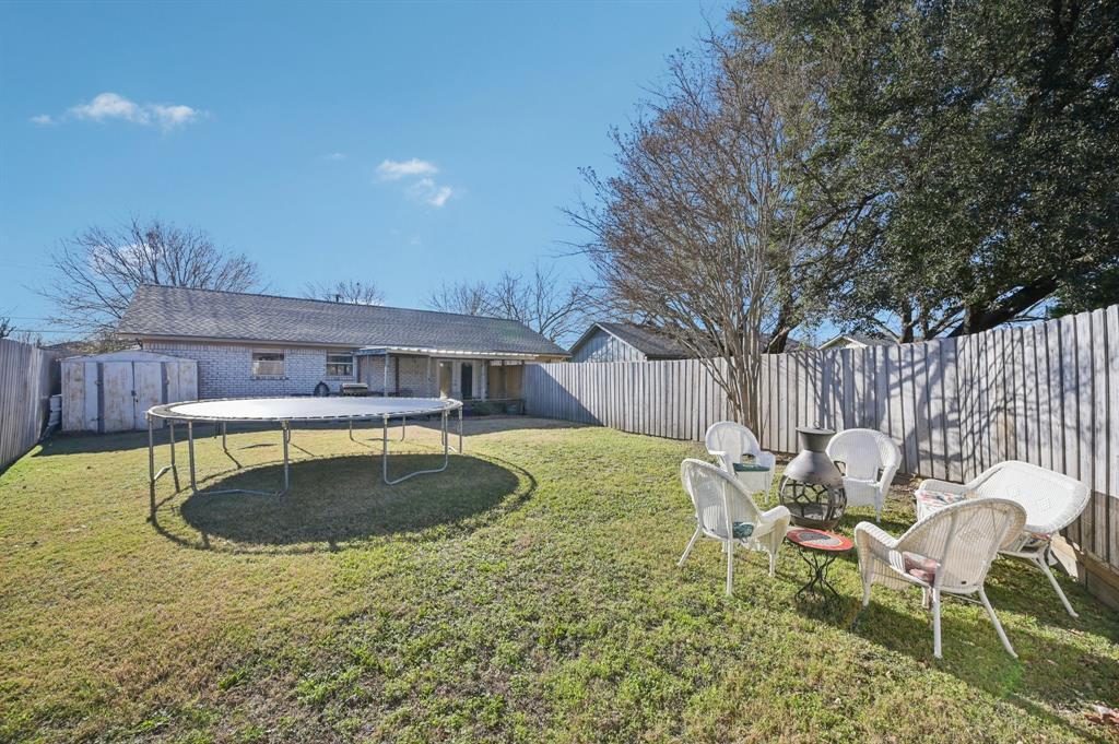 1021 Pleasant Valley Road Garland, TX 75040 - Photo 29 of 32 a swimming pool with outdoor seating