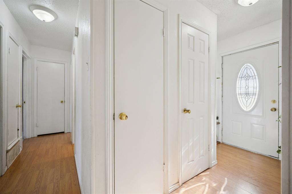 1021 Pleasant Valley Road Garland, TX 75040 - Photo 5 of 32 a view of a bathroom with wooden floor