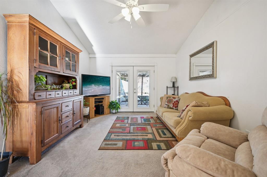 1021 Pleasant Valley Road Garland, TX 75040 - Photo 6 of 32 a living room with furniture fireplace and flat screen tv
