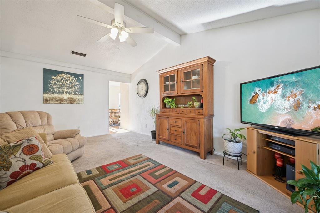 1021 Pleasant Valley Road Garland, TX 75040 - Photo 8 of 32 a living room with furniture and a flat screen tv