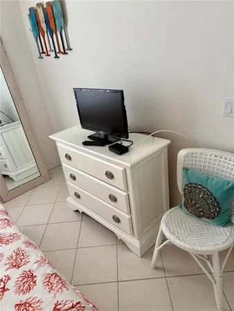a bedroom with a bed and a chair