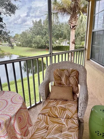 a bedroom with a bed and a chair