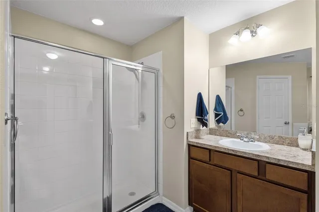 a bathroom with a double vanity sink and mirror