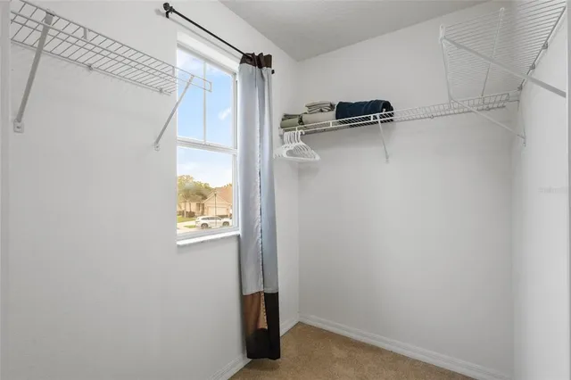 a view of walk in closet with window