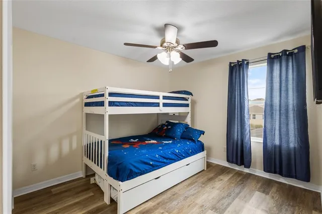 a living room with a bed and a window