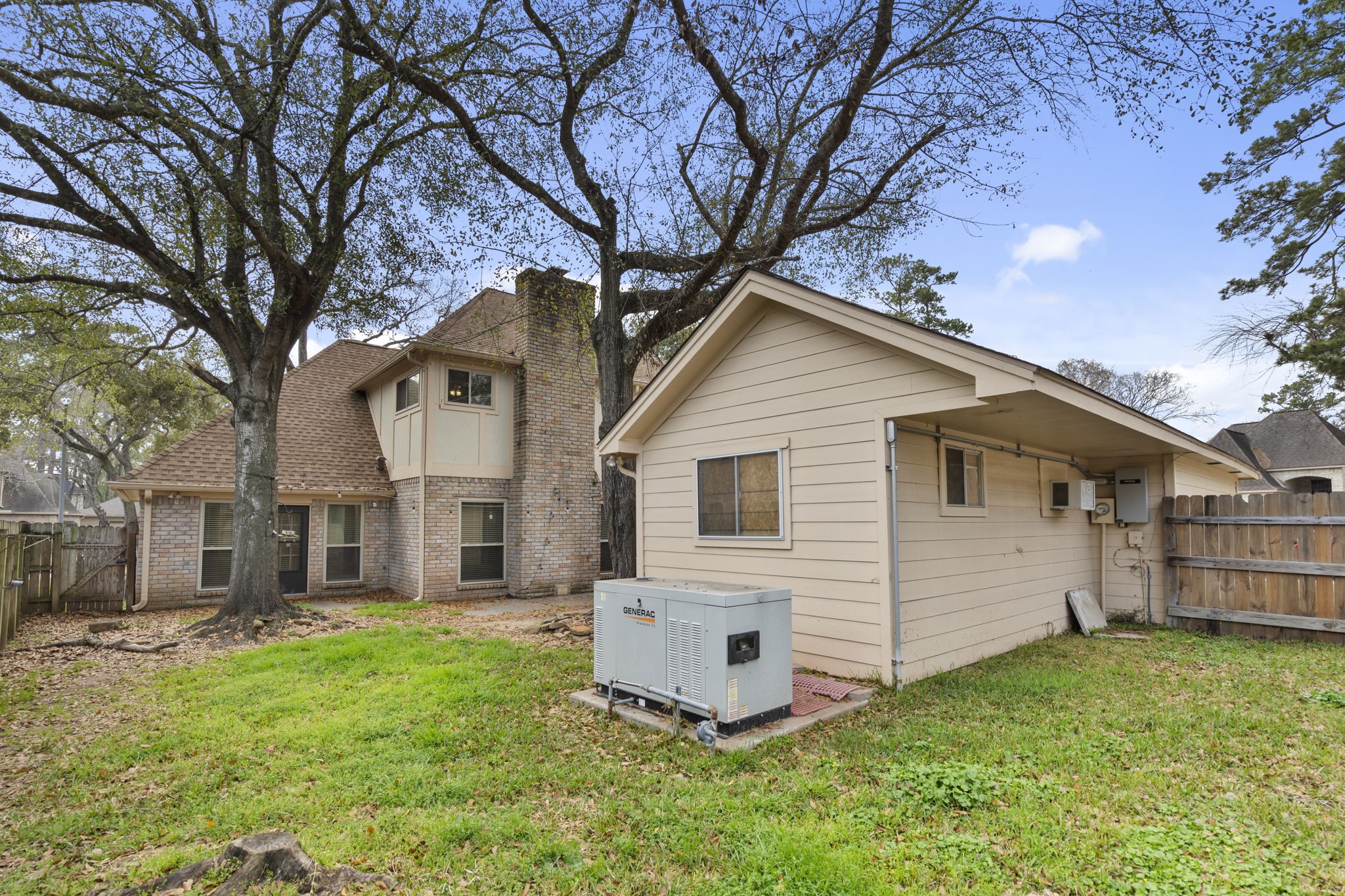 18326 Lake Oaks Drive Spring, TX 77388 - Photo 25 of 37 Large backyard with generator