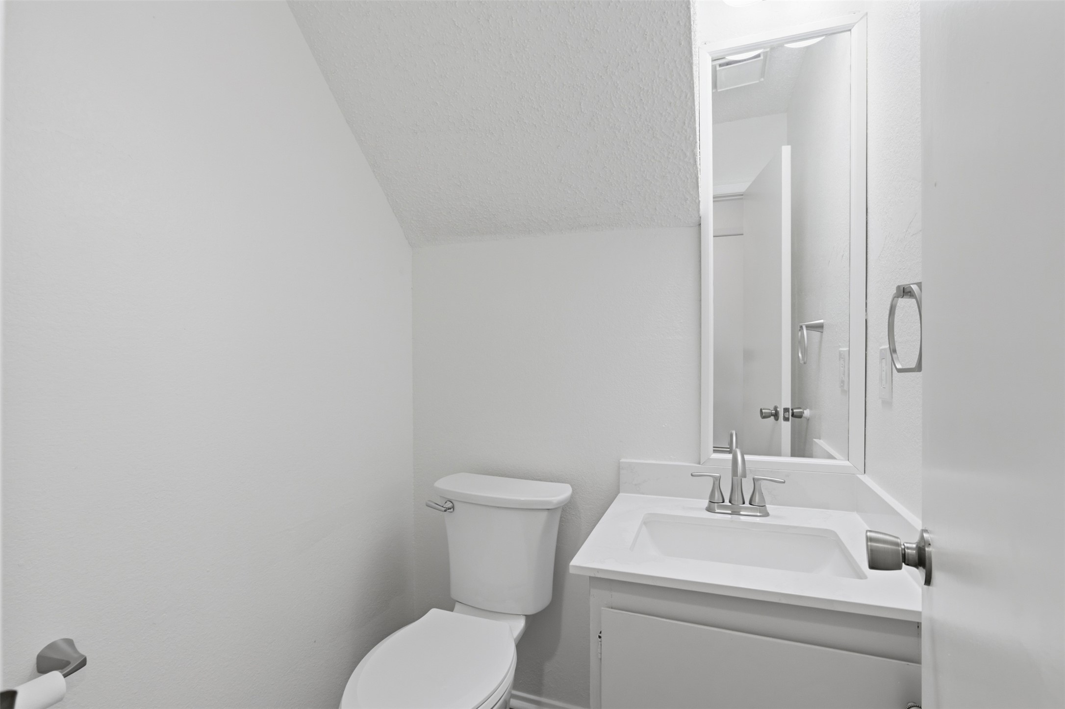 6105 Conti Court, Unit A Austin, TX 78744 - Photo 16 of 36 a bathroom with a toilet sink and mirror