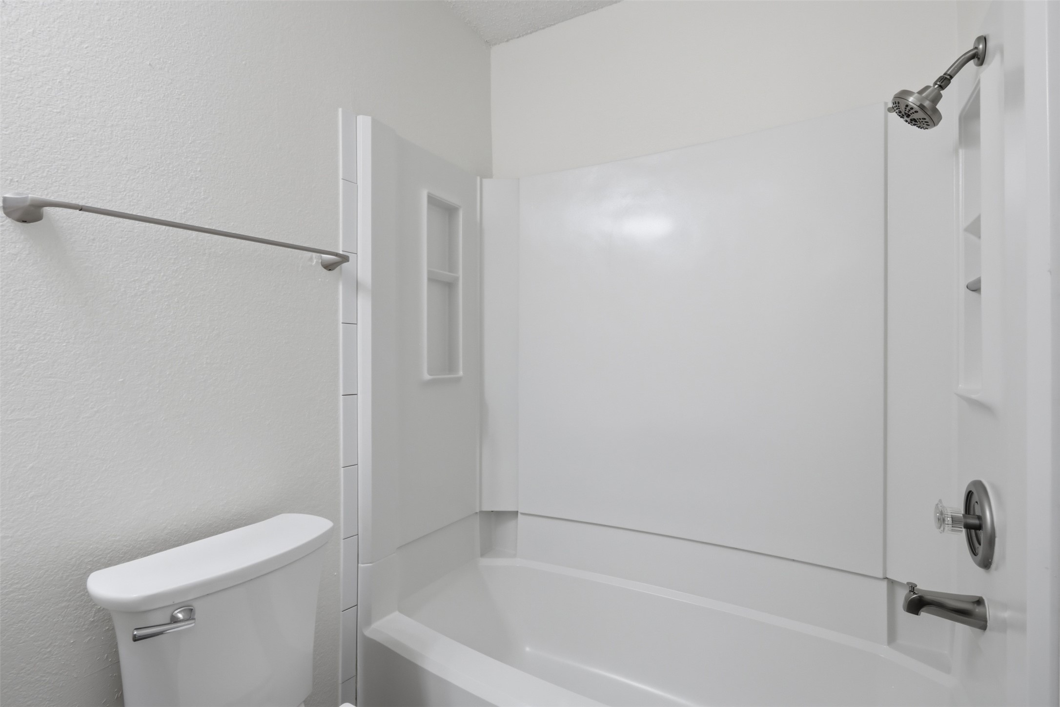 6105 Conti Court, Unit A Austin, TX 78744 - Photo 20 of 36 a bathroom with a bathtub and a toilet