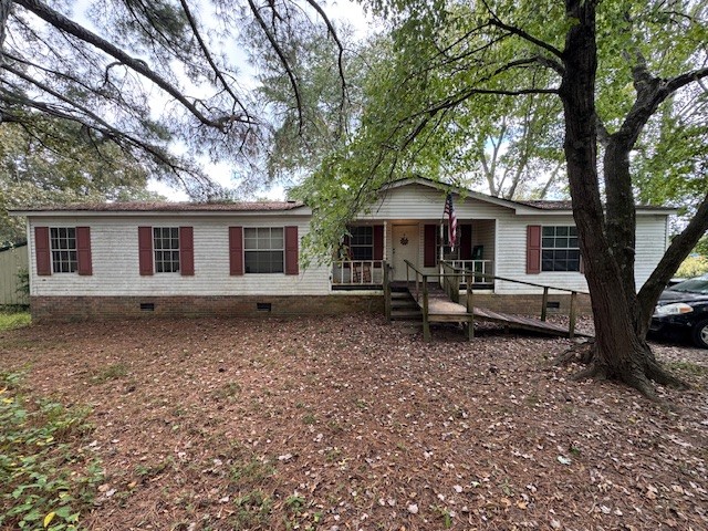 a backyard of a house with yard barbeque oven and outdoor seating