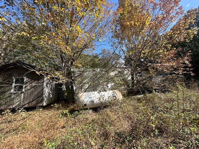 1347 Bertha Owen Road Morrison, TN 37357 - Photo 20 of 23 a backyard of a house with a large tree
