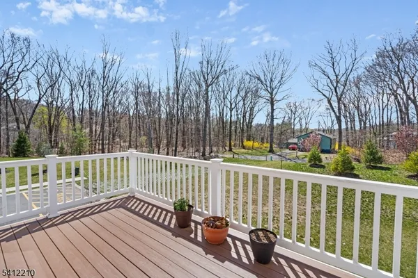 a view of a wooden deck with trees