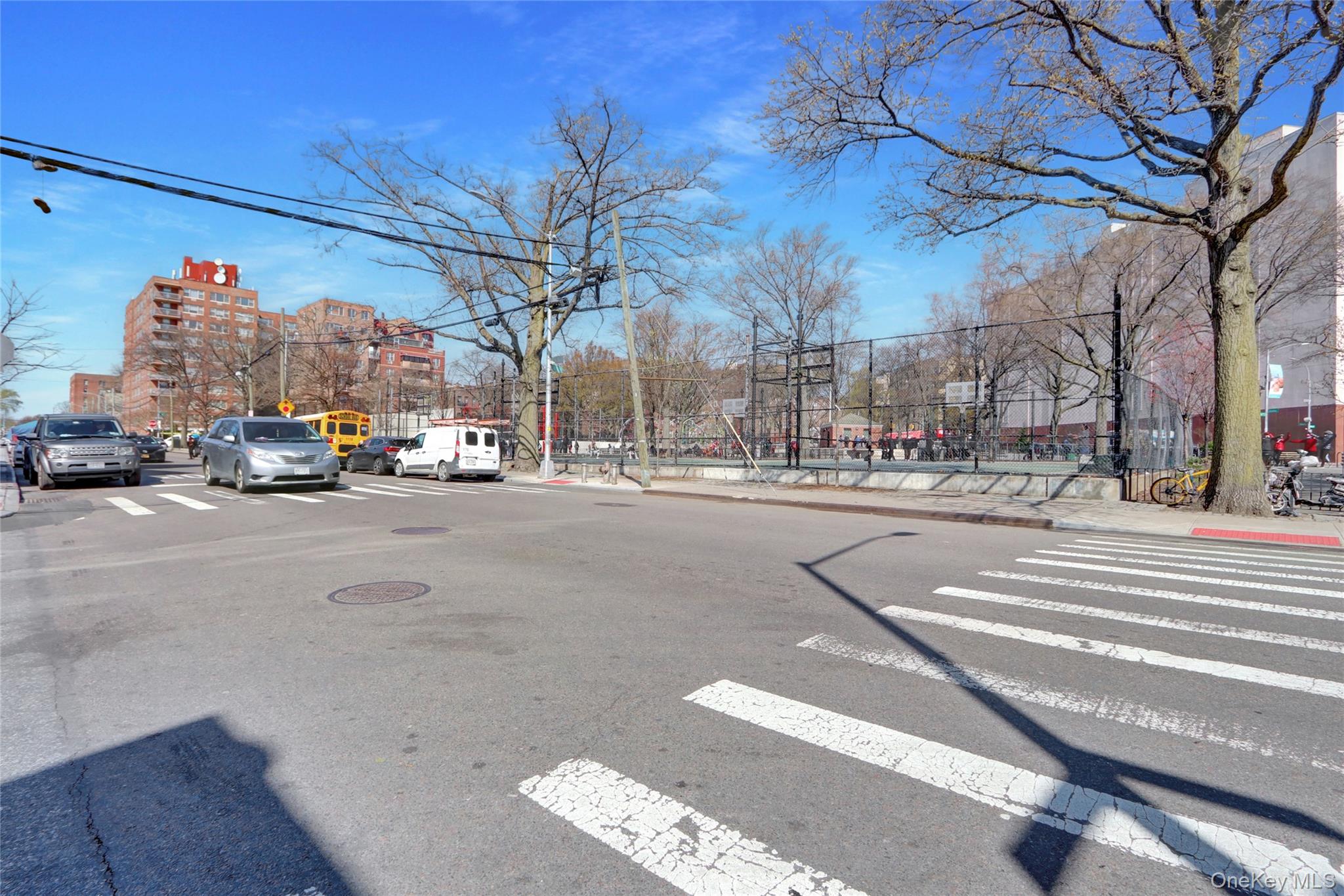 45-16 83rd Street, Unit W7C Queens, NY 11373 - Photo 14 of 16 a view of city street with a parked cars
