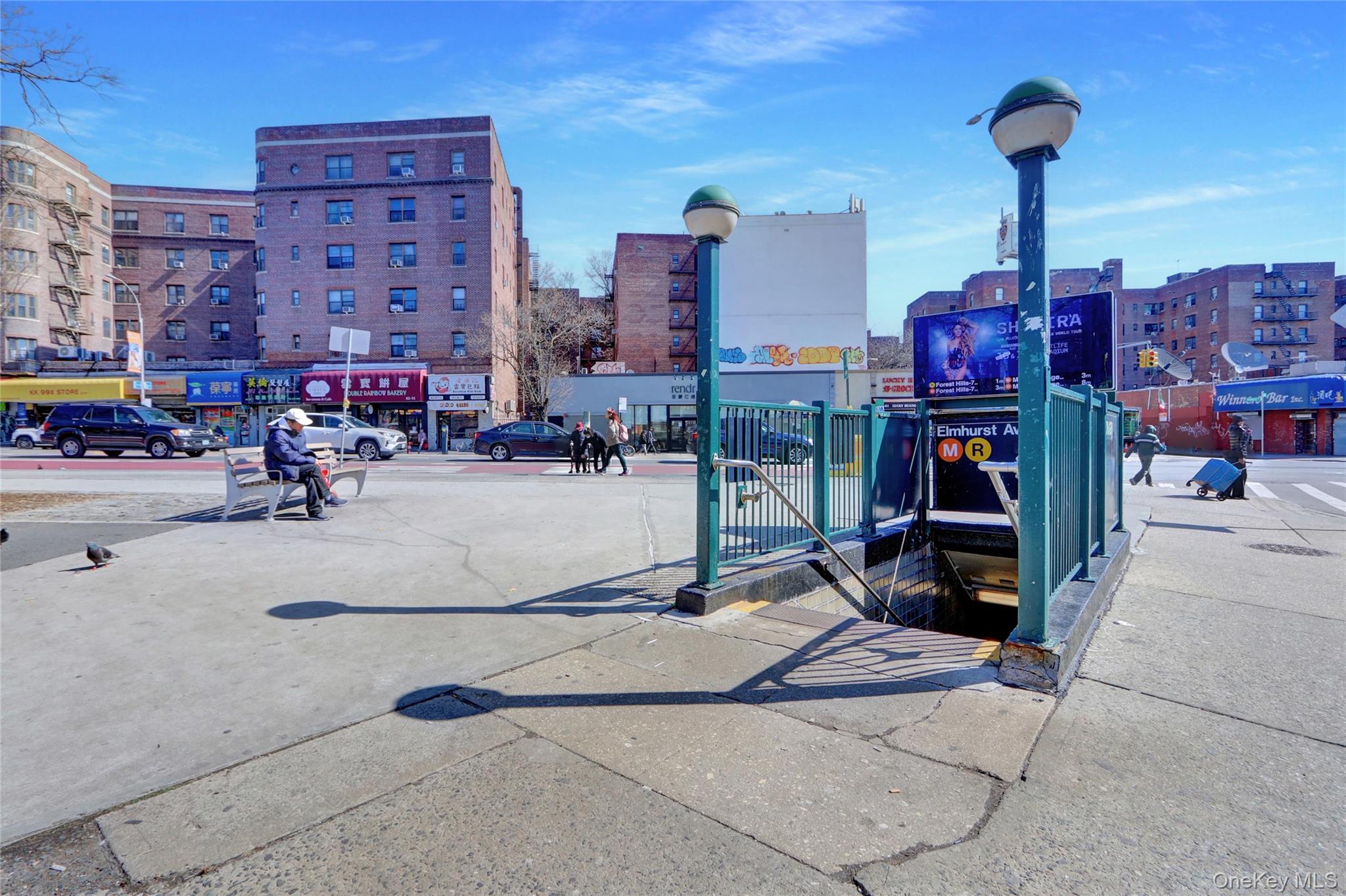 45-16 83rd Street, Unit W7C Queens, NY 11373 - Photo 15 of 16 a group of cars parked in front of building