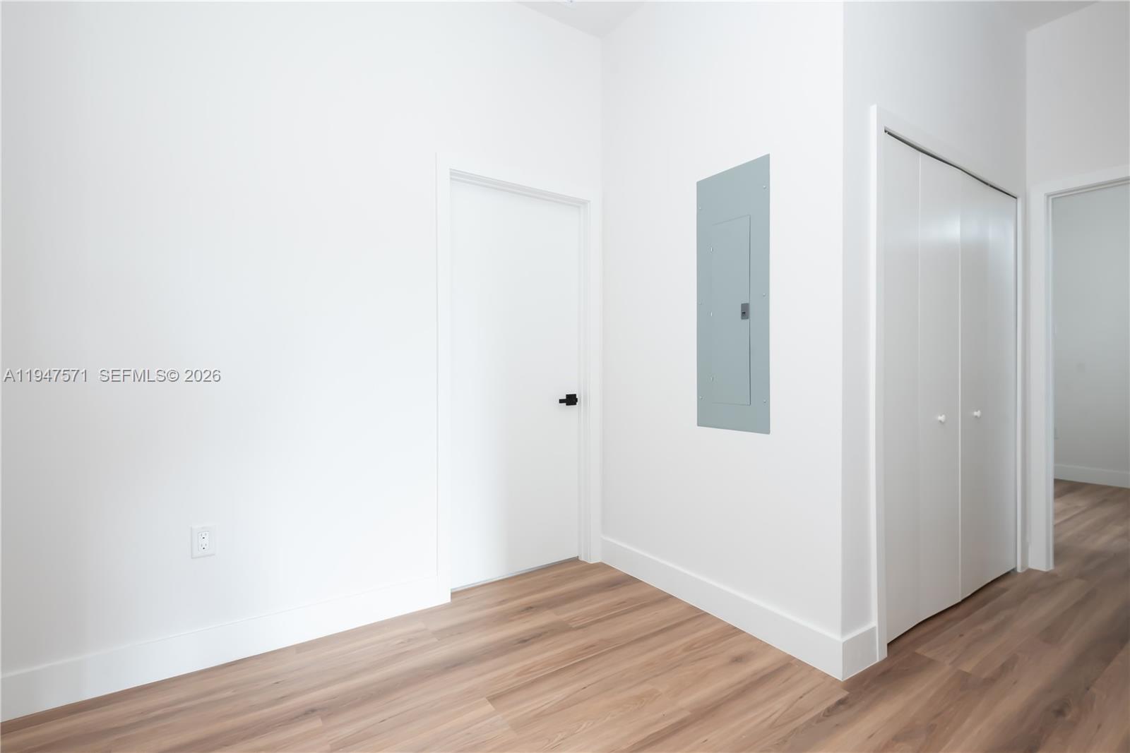 4517 Northwest 3rd Street Miami, FL 33126 - Photo 16 of 34 a view of an empty room with wooden floor