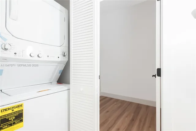 a view of washer and dryer with bathroom