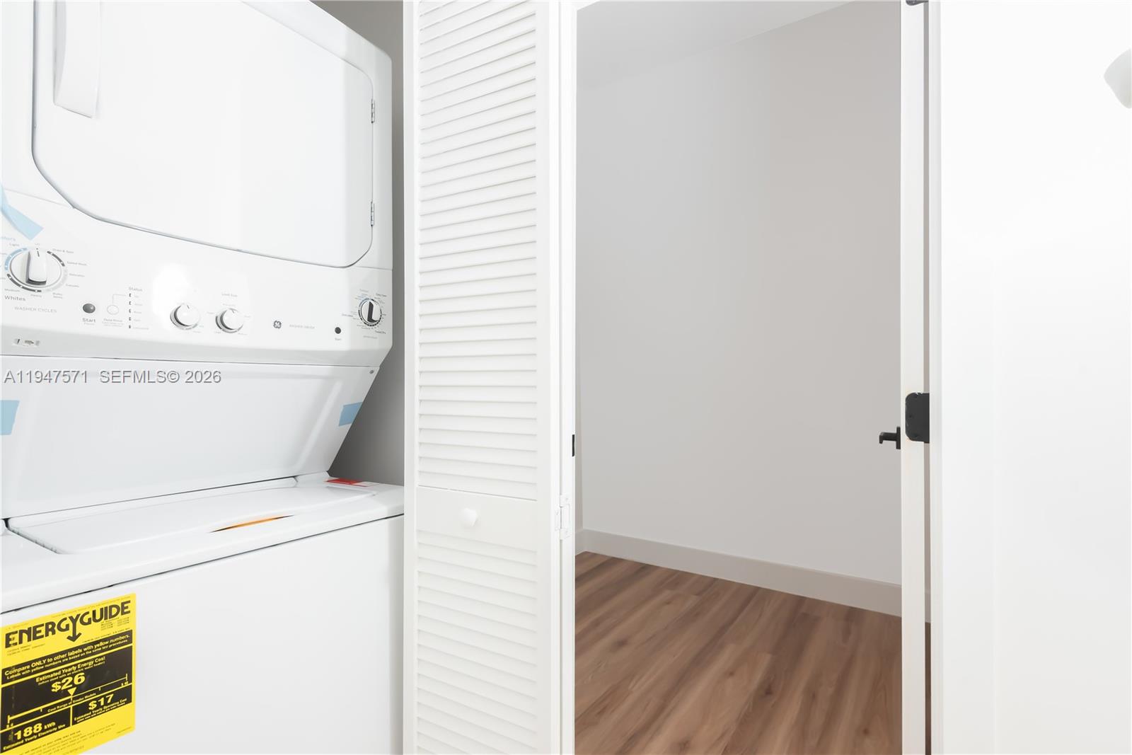 4517 Northwest 3rd Street Miami, FL 33126 - Photo 29 of 34 a view of washer and dryer with bathroom