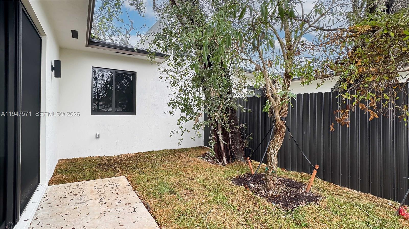 4517 Northwest 3rd Street Miami, FL 33126 - Photo 3 of 34 a view of a backyard of the house