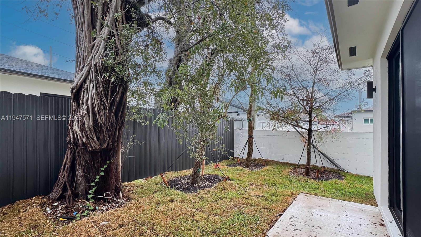4517 Northwest 3rd Street Miami, FL 33126 - Photo 5 of 34 a view of a backyard of the house