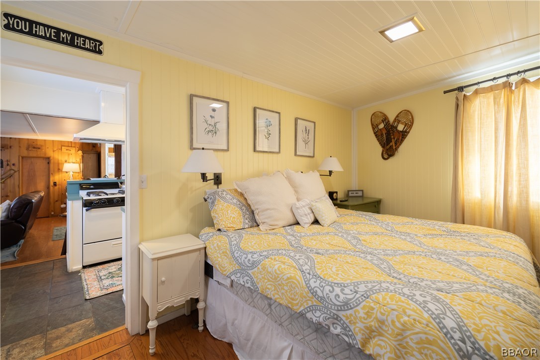 408 Conklin Road Big Bear Lake, CA 92315 - Photo 13 of 24 a bedroom with a bed and a view of living room