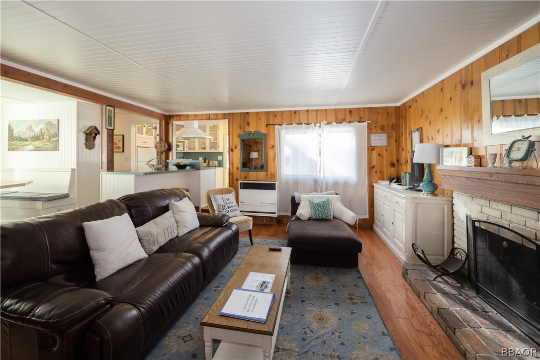 408 Conklin Road Big Bear Lake, CA 92315 - Photo 3 of 24 a living room with furniture a large window and a fireplace