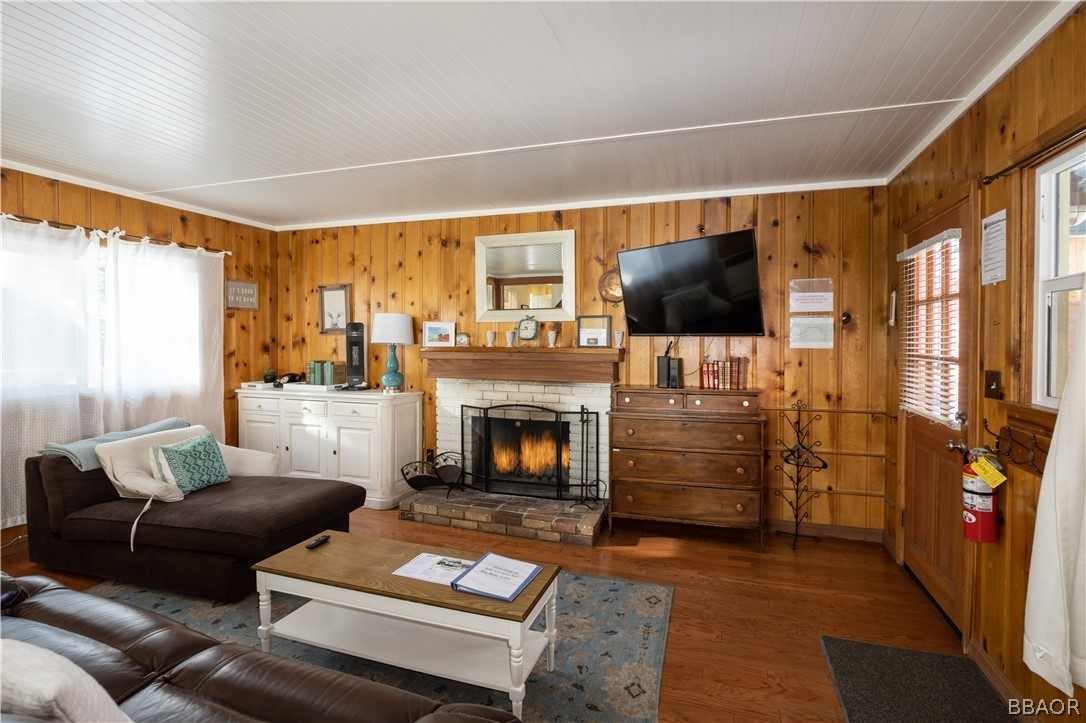 408 Conklin Road Big Bear Lake, CA 92315 - Photo 6 of 24 a living room with furniture a flat screen tv and a fireplace