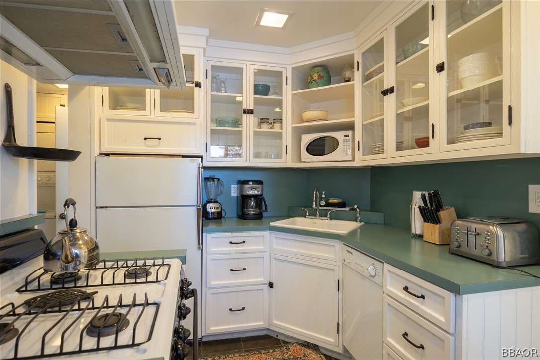 408 Conklin Road Big Bear Lake, CA 92315 - Photo 9 of 24 a kitchen with a cabinets and white appliances