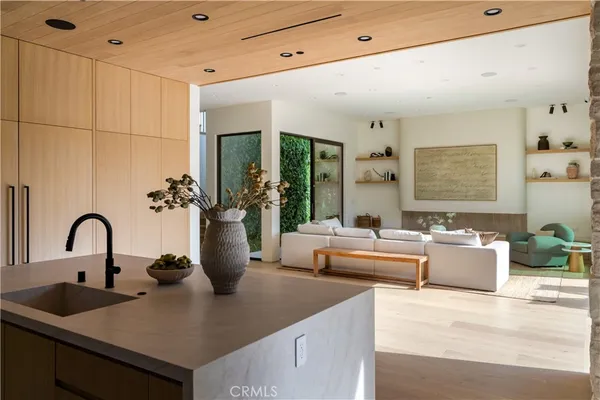 a kitchen with a sink and a large window