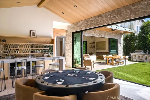 a view of an house with backyard and patio