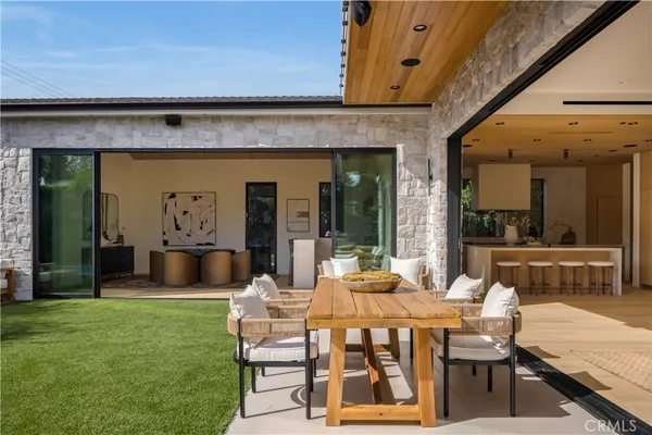 a view of a chairs and table in the patio