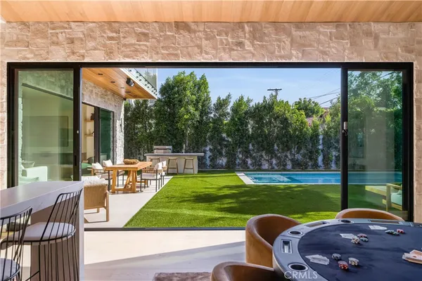 a view of swimming pool with outdoor seating